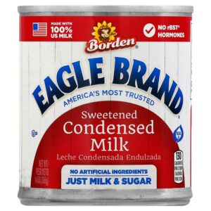 Close up of a red and white can of Borden’s Eagle Brand Sweetened Condensed Milk. 