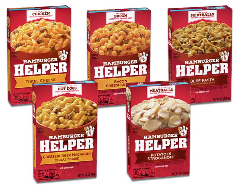 Two rows, three in back and two in front, of five red boxes of Hamburger Helper products ranging from Three Cheese to Potatoes Stroganoff. 